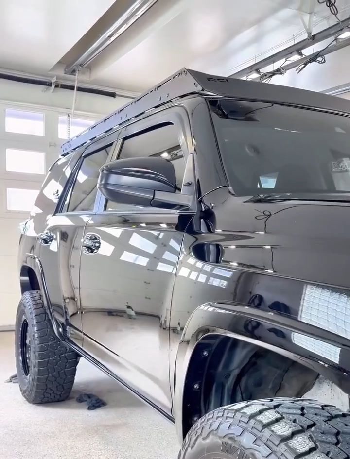 Glossy black Toyota 4Runner in the studio